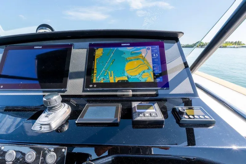 Slide: The Image of 2022 Pardo Yachts 38 cruising on open water under a clear sky. - 8