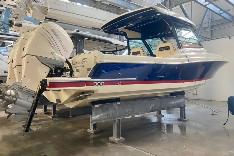 The Image of 2022 Chris-Craft Calypso 35 boat with dual Mercury engines in a showroom. - 0