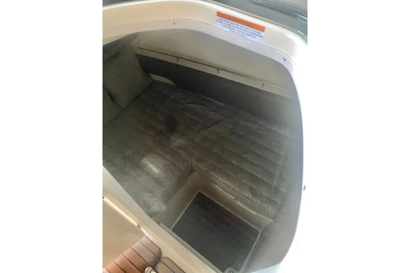 Slide: The Image of 2022 Chris-Craft Calypso 35 cabin interior with cushioned seating. - 14