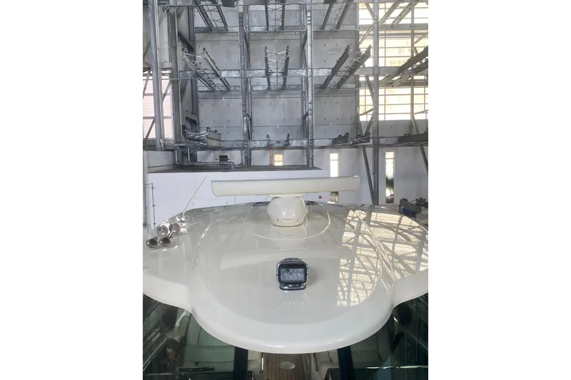 Slide: The Image of 2022 Chris-Craft Calypso 35 yacht in a modern indoor storage facility. - 17