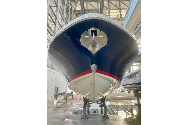 Slide: The Image of 2022 Chris-Craft Calypso 35 boat in a storage facility, viewed from the front. - 3