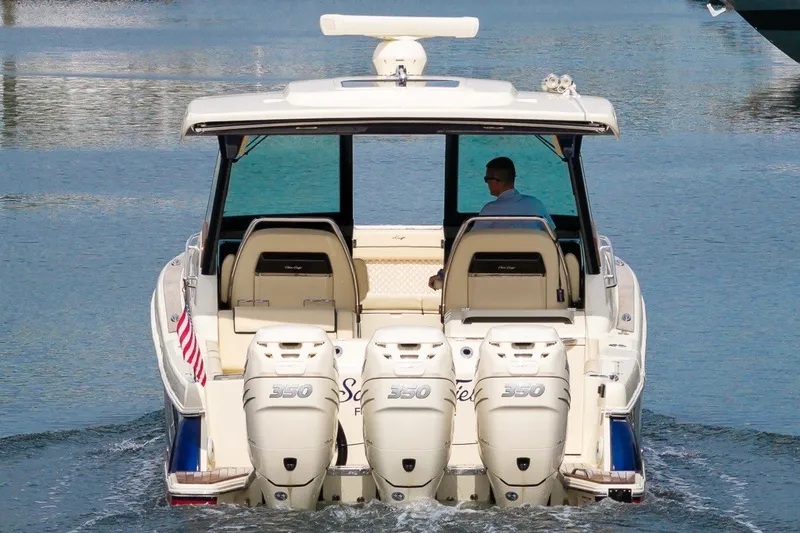 Slide: The Image of 2022 Chris-Craft Calypso 35 boat with triple 350 engines on calm water. - 6