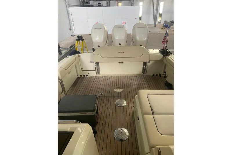 Slide: The Image of 2022 Chris-Craft Calypso 35 boat interior with wooden deck and seating. - 8