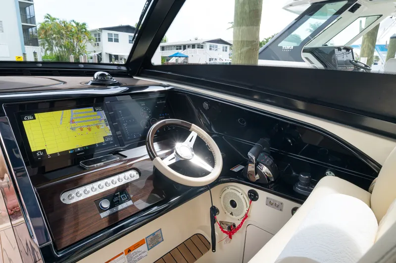 Slide: The Image of 2022 Chris-Craft Calypso 35 helm with advanced navigation system and luxurious interior. - 16