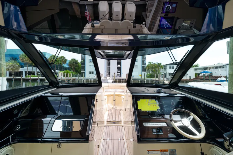 Slide: The Image of 2022 Chris-Craft Calypso 35 cockpit with modern navigation system and luxurious interior. - 23