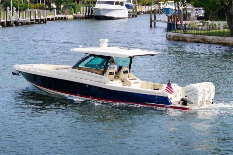 Slide: The Image of 2022 Chris-Craft Calypso 35 boat cruising on a scenic waterway. - 3
