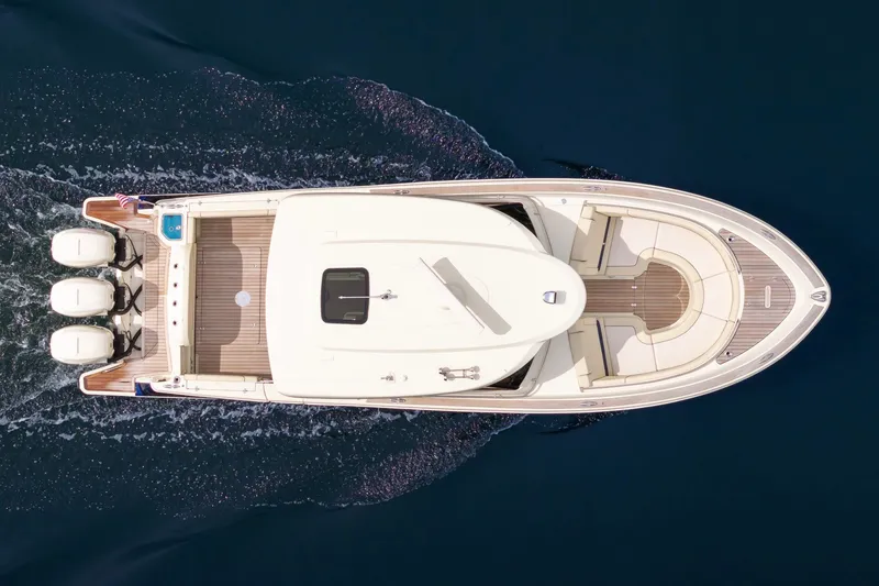 Slide: The Image of Overhead view of 2022 Chris-Craft Calypso 35 boat cruising on water. - 14