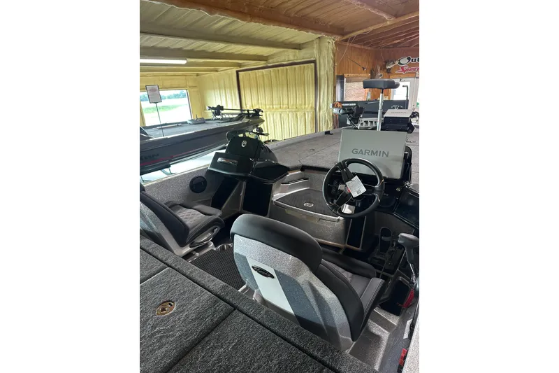 Slide: The Image of 2026 iKon LXE20 boat interior with Garmin navigation system in showroom. - 3