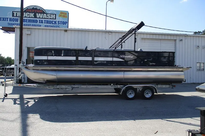 The Image of 2026 Bentley Pontoons Fish 240 N-Cruise on trailer, parked outside a truck wash. - 1
