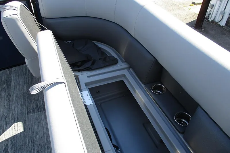 Slide: The Image of 2026 Bentley Pontoons Fish 240 N-Cruise interior seating with storage and cup holders. - 13
