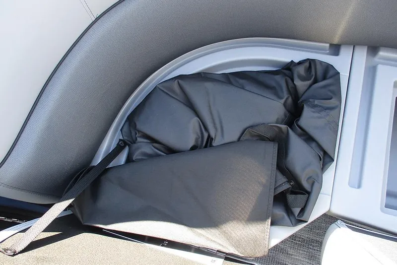 Slide: The Image of 2026 Bentley Pontoons Fish 240 N-Cruise interior storage compartment with black cover. - 15