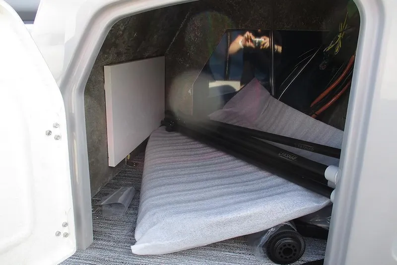 Slide: The Image of Storage compartment of 2026 Bentley Pontoons Fish 240 N-Cruise with equipment and accessories. - 27