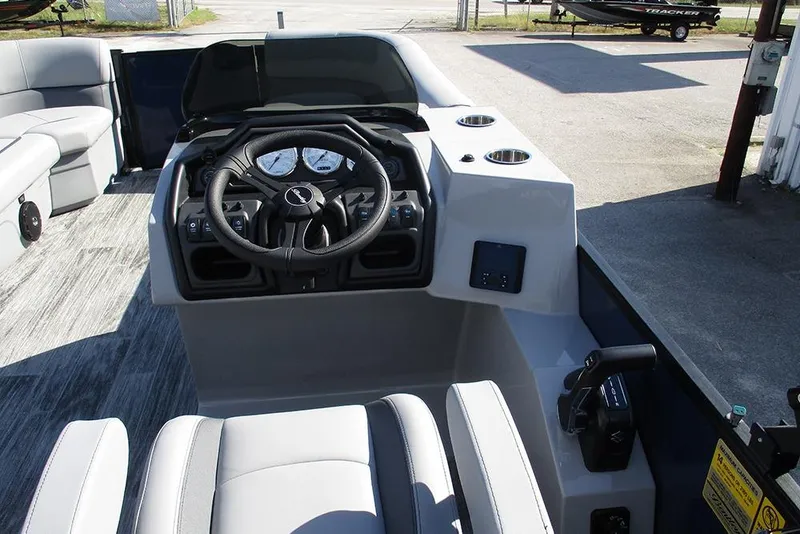 Slide: The Image of 2026 Bentley Pontoons Fish 240 N-Cruise helm with steering wheel and controls. - 28