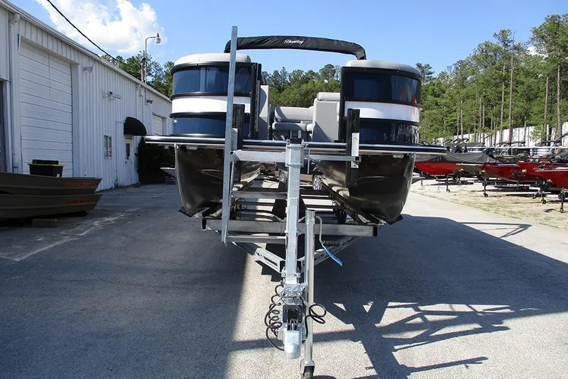Slide: The Image of 2026 Bentley Pontoons Fish 240 N-Cruise on trailer, parked outdoors near a building. - 4