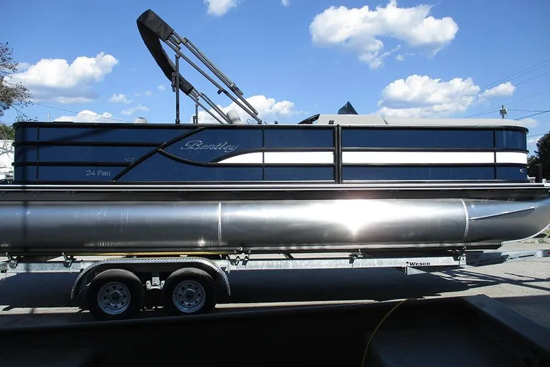 Slide: The Image of 2026 Bentley Pontoons Fish 240 N-Cruise on trailer under blue sky. - 6