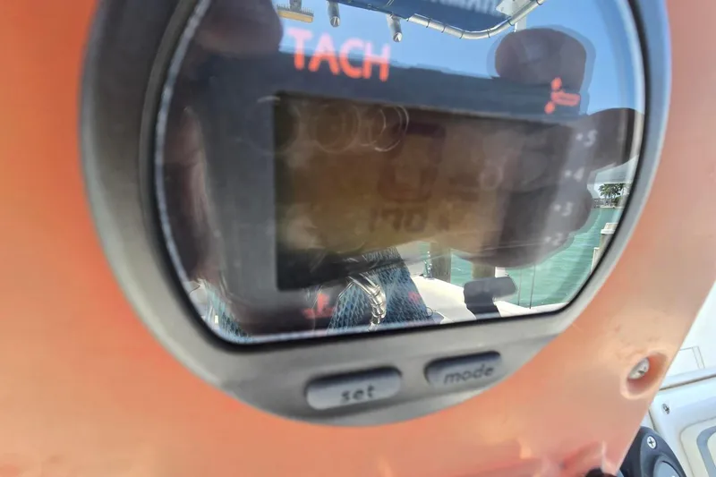 Slide: The Image of Close-up of tachometer on 2012 Sea Hunt Ultra 225 boat dashboard. - 11
