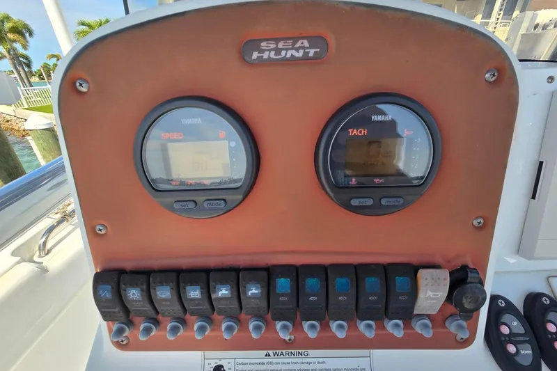 Slide: The Image of Control panel of a 2012 Sea Hunt Ultra 225 boat with Yamaha gauges. - 12