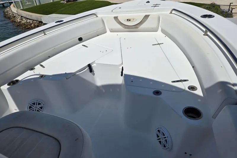 Slide: The Image of 2012 Sea Hunt Ultra 225 boat interior with seating and storage compartments. - 27