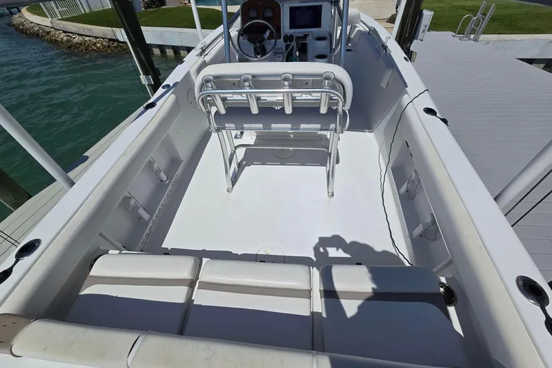 Slide: The Image of 2012 Sea Hunt Ultra 225 boat interior with seating and console. - 5