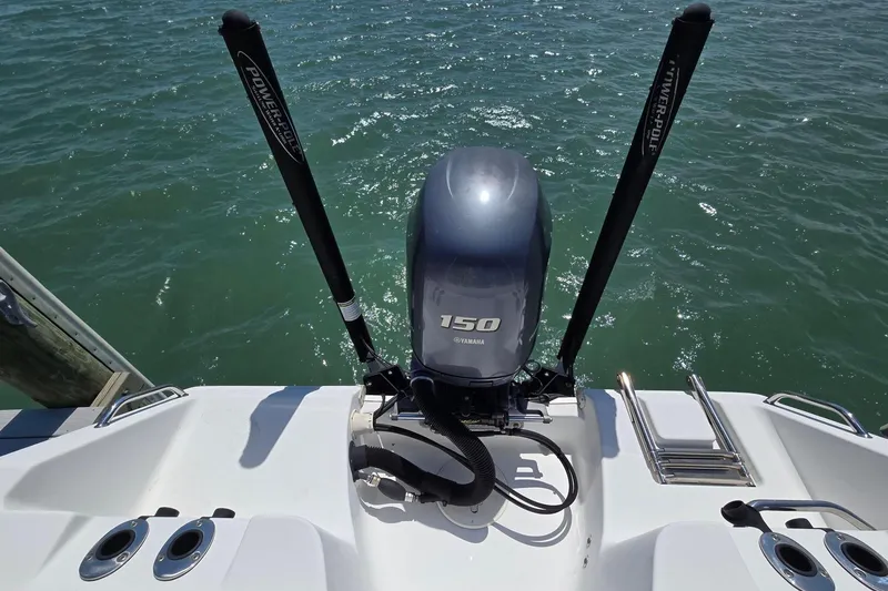 Slide: The Image of 2012 Sea Hunt Ultra 225 boat with Yamaha 150 engine on water. - 7