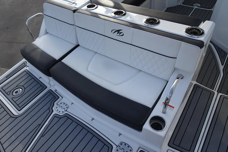 Slide: The Image of Luxurious seating on 2017 Monterey M-65 boat with cup holders and stylish design. - 10