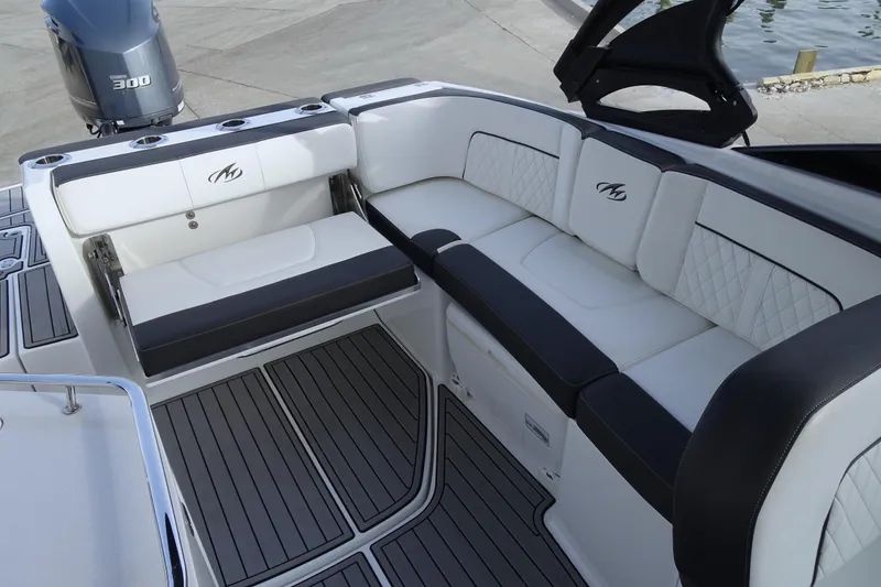Slide: The Image of Luxurious seating on a 2017 Monterey M-65 boat with stylish upholstery and cup holders. - 11