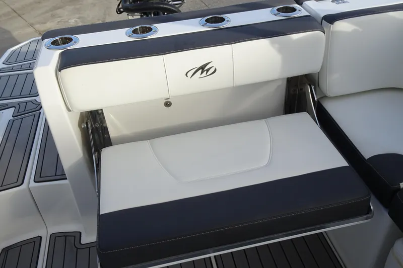 Slide: The Image of Luxury seating on a 2017 Monterey M-65 boat with cup holders and sleek design. - 12
