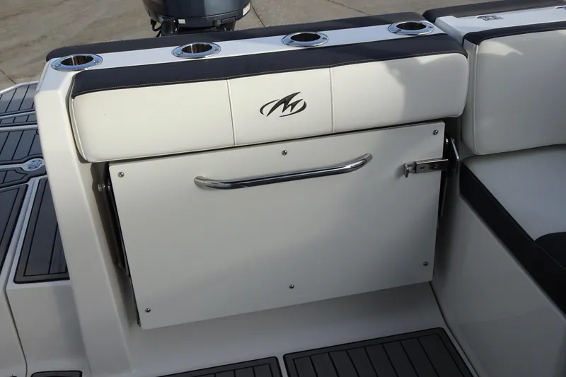 Slide: The Image of 2017 Monterey M-65 boat seating with integrated cup holders and storage compartment. - 13