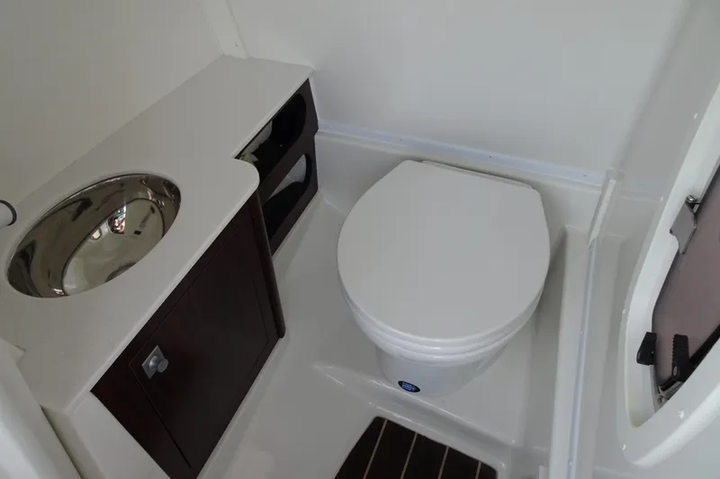 Slide: The Image of Compact bathroom in 2017 Monterey M-65 boat with sink and toilet. - 18