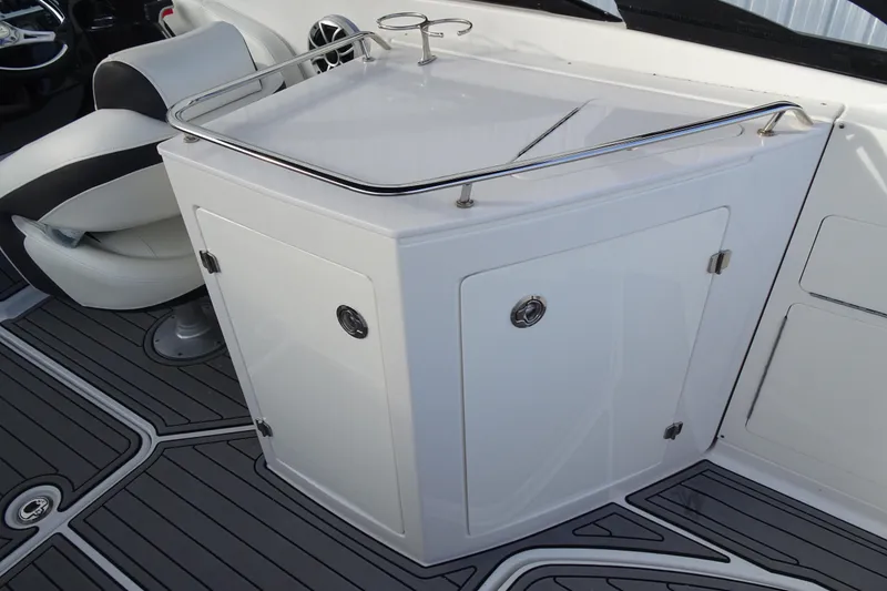 Slide: The Image of 2017 Monterey M-65 boat interior with sleek white cabinetry and seating. - 20