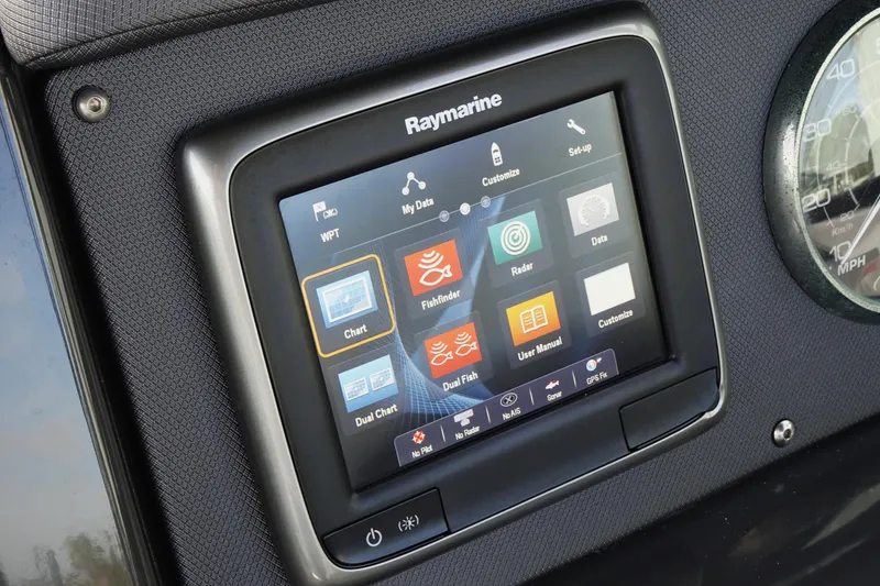 Slide: The Image of Raymarine display on 2017 Monterey M-65 boat dashboard, featuring navigation and fishfinder options. - 23