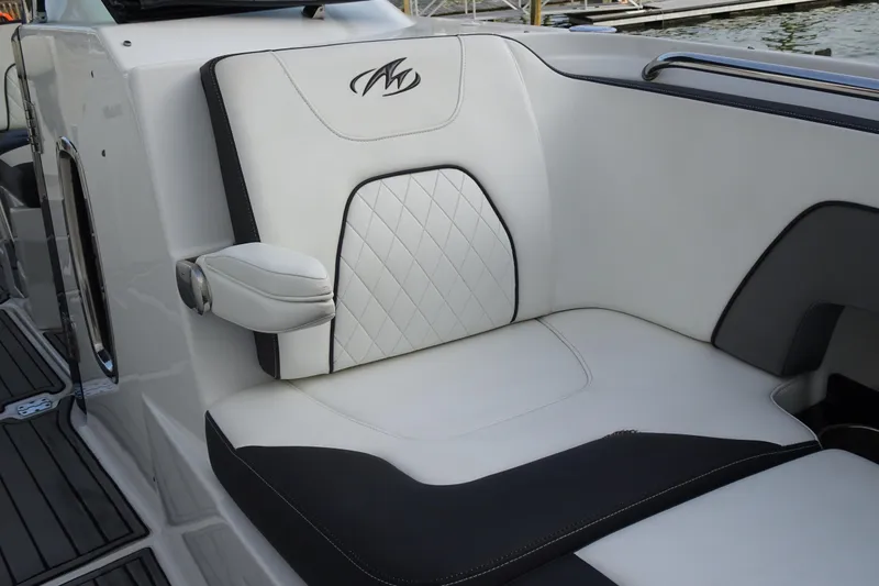 Slide: The Image of Luxurious seating on a 2017 Monterey M-65 boat, featuring elegant white and black upholstery. - 26