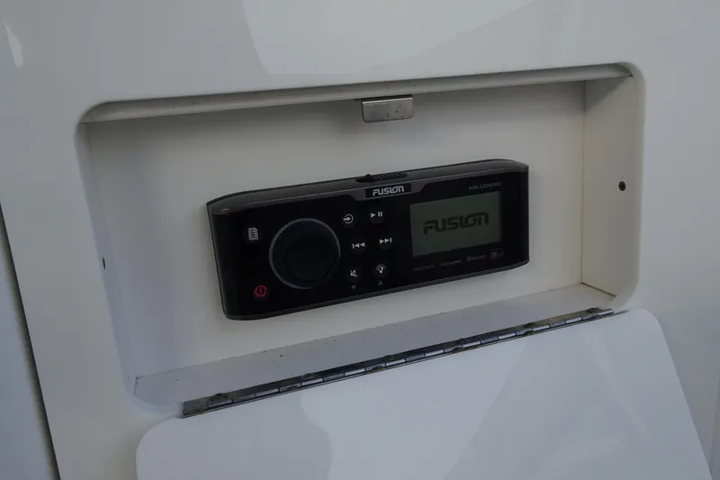 Slide: The Image of Fusion marine stereo system in a 2017 Monterey M-65 boat dashboard. - 30