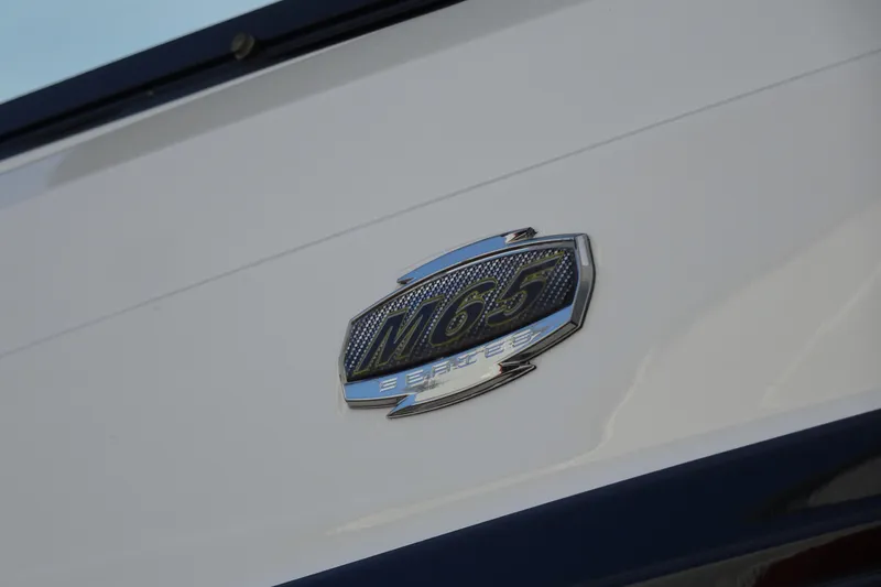 Slide: The Image of Monterey M-65 2017 boat emblem on white surface. - 32