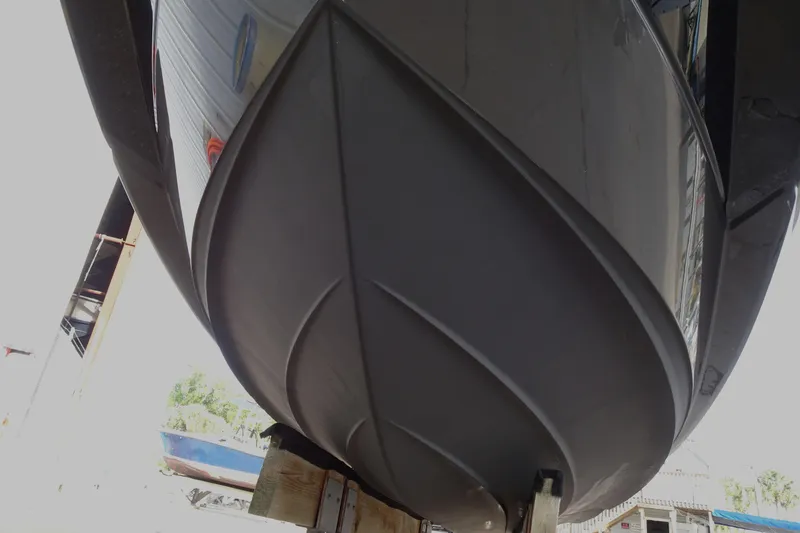 Slide: The Image of 2017 Monterey M-65 boat hull in dry dock, showcasing sleek design and craftsmanship. - 4