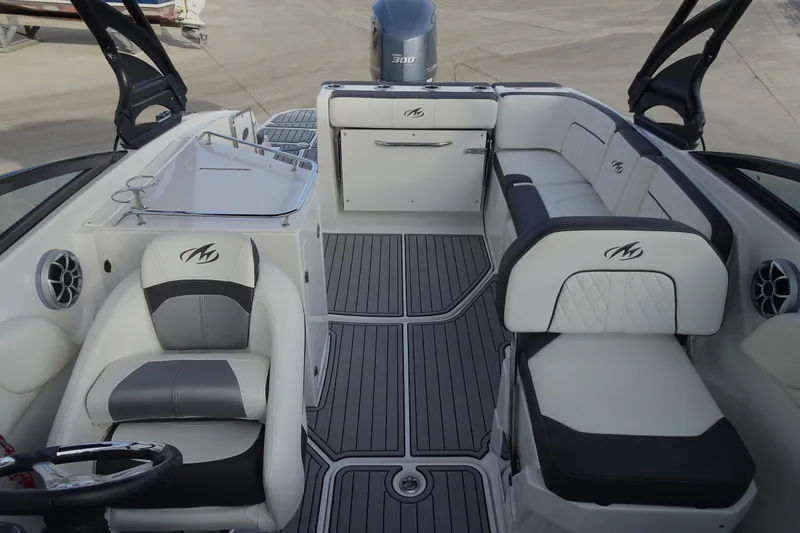 Slide: The Image of 2017 Monterey M-65 boat interior with sleek seating and modern design. - 8