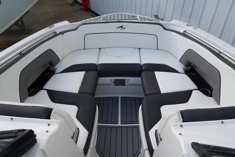 Slide: The Image of Luxurious seating area on a 2017 Monterey M-65 boat with sleek black and white upholstery. - 9