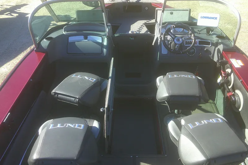 Slide: The Image of 2017 Lund 1875 Crossover XS boat interior with seating and steering console. - 11