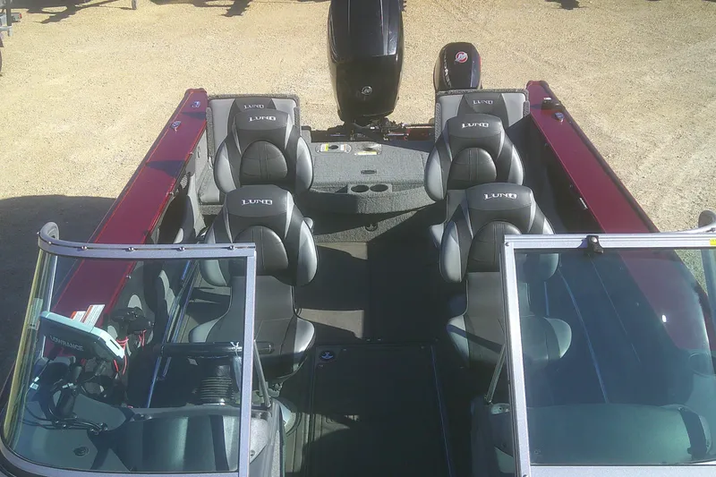 Slide: The Image of 2017 Lund 1875 Crossover XS boat interior with seating and windshield. - 14
