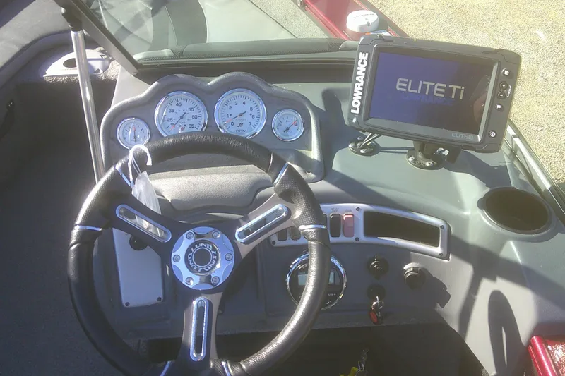 Slide: The Image of 2017 Lund 1875 Crossover XS dashboard with steering wheel and Lowrance Elite Ti display. - 15