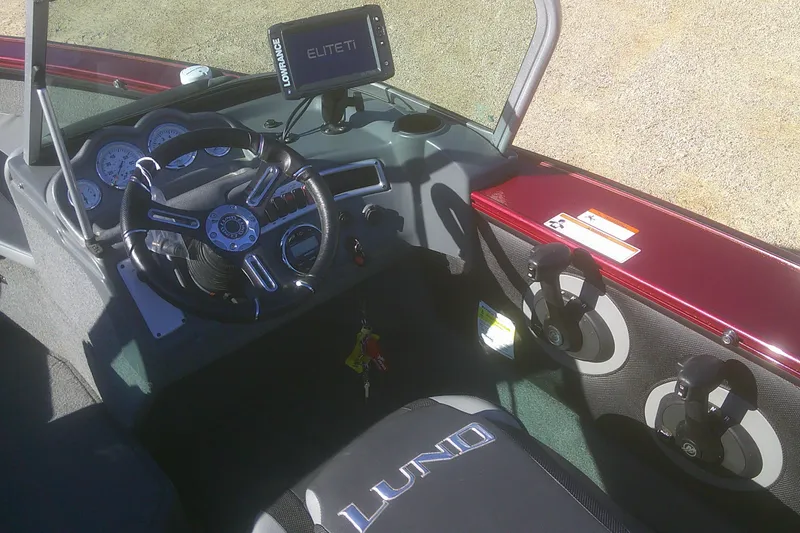 Slide: The Image of Interior of 2017 Lund 1875 Crossover XS boat with steering wheel and Lowrance Elite Ti display. - 16