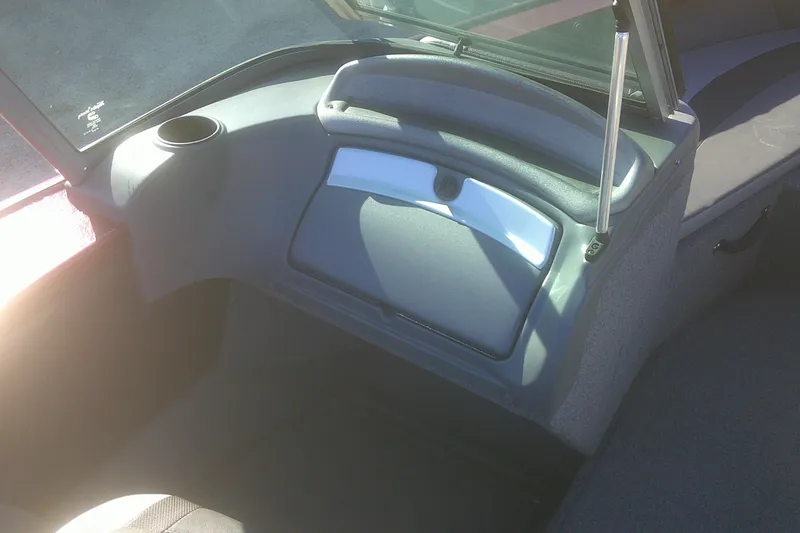 Slide: The Image of Interior of 2017 Lund 1875 Crossover XS boat showing dashboard and storage compartment. - 18