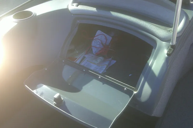 Slide: The Image of Open storage compartment in a 2017 Lund 1875 Crossover XS boat. - 19