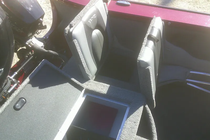 Slide: The Image of 2017 Lund 1875 Crossover XS boat interior with storage compartments and seating. - 22