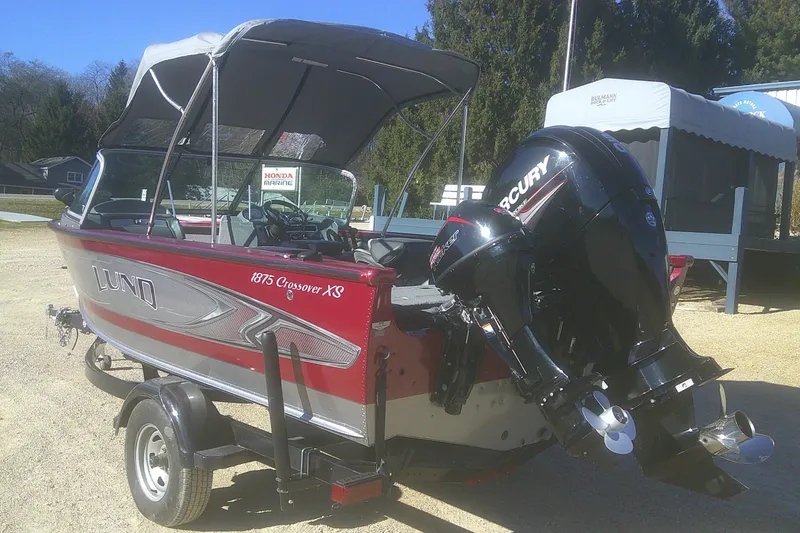 Slide: The Image of 2017 Lund 1875 Crossover XS boat with Mercury outboard motor on trailer. - 3