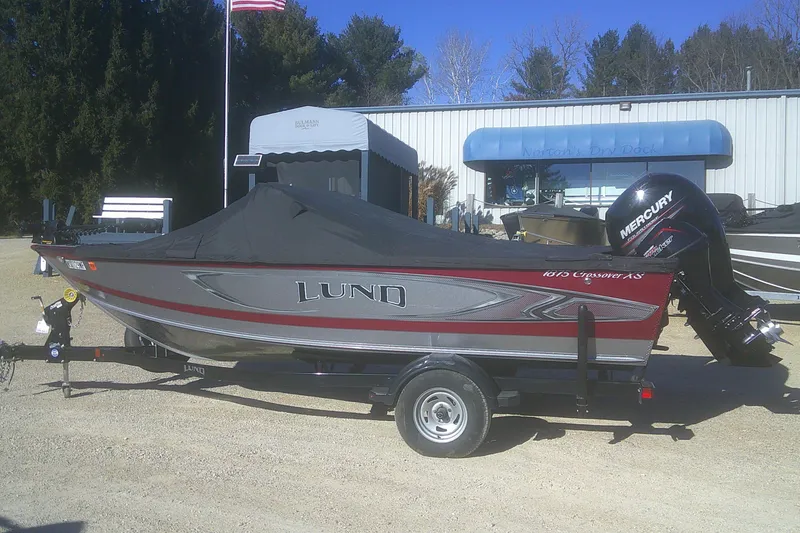 Slide: The Image of 2017 Lund 1875 Crossover XS boat with cover and Mercury outboard motor. - 31