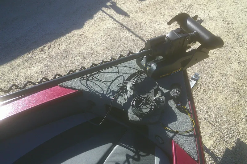 Slide: The Image of 2017 Lund 1875 Crossover XS boat with trolling motor and control cables on deck. - 7