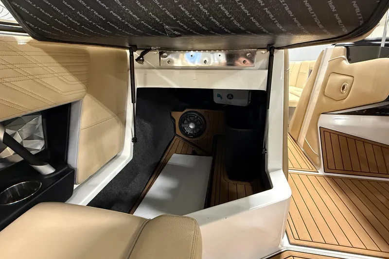 Slide: The Image of 2020 Nautique Super Air Nautique G21 interior with premium seating and speaker system. - 4