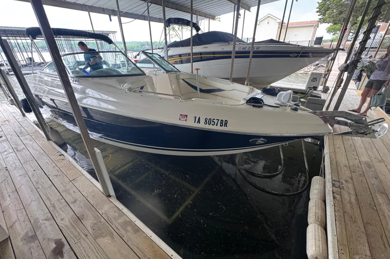 The Image of 2006 Rinker 282 Captiva Bowrider docked in a covered marina. - 0