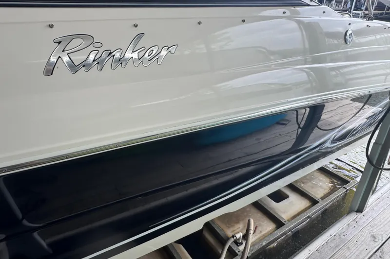 Slide: The Image of 2006 Rinker 282 Captiva Bowrider boat side view at dock. - 25
